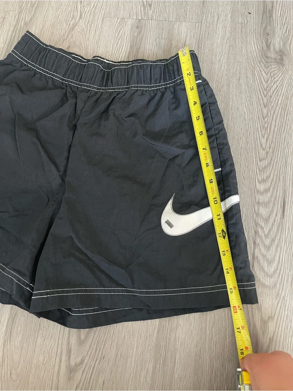 Nike Black Athletic Shorts with White Swoosh Accent